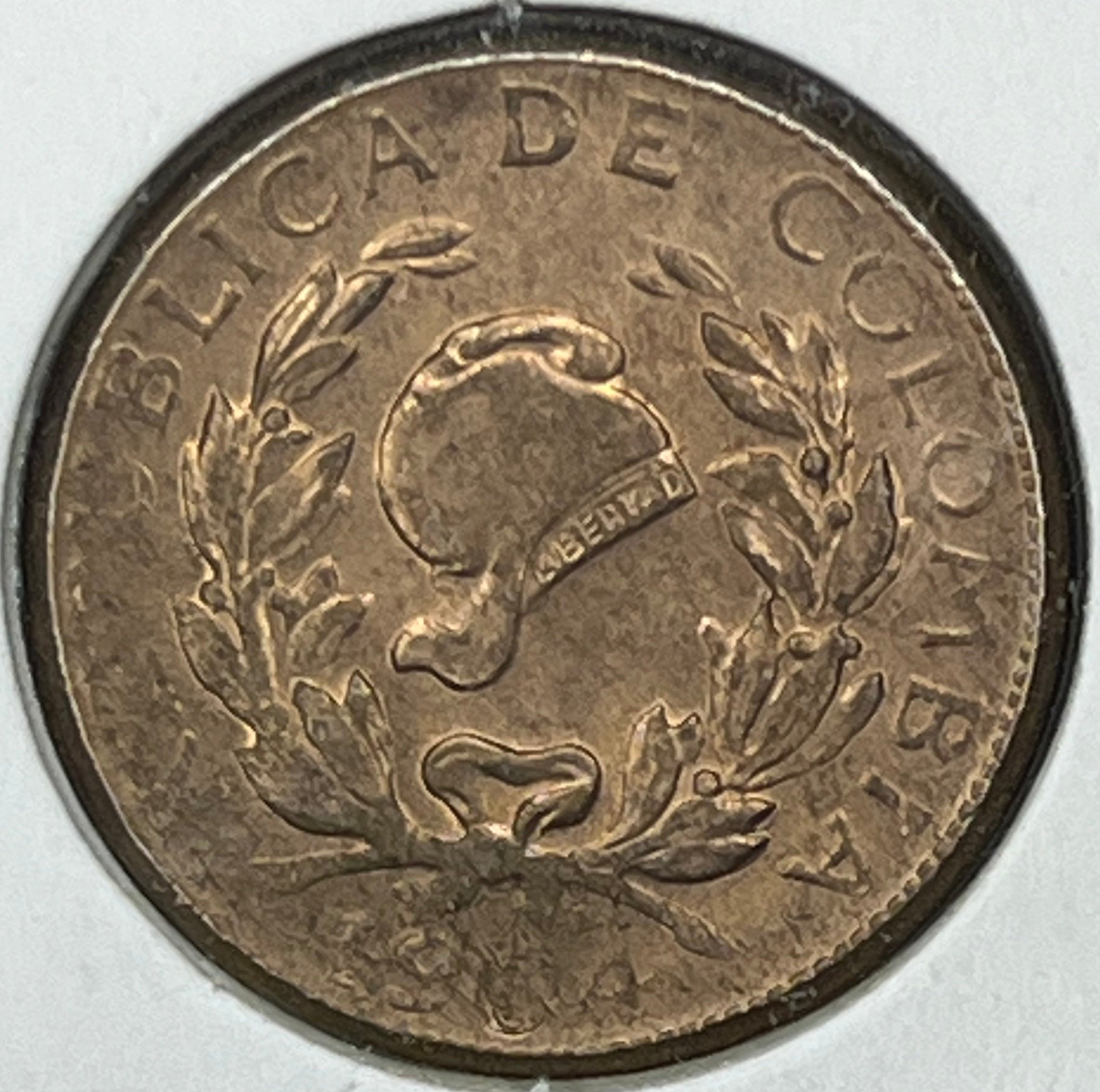 Bronze coin with 'Colombia' text on a white background