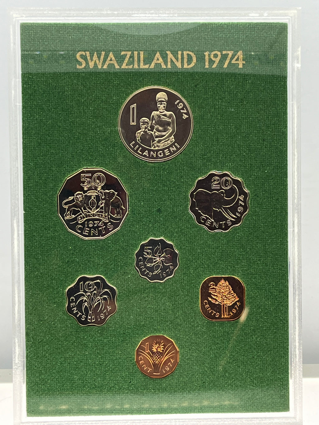 Set of Swaziland coins from 1974 in a green holder with gold and bronze coins.